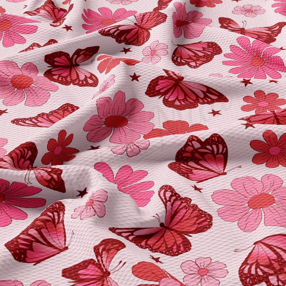 a pink and red butterfly print fabric
