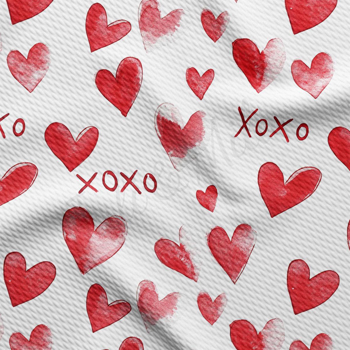 a repeating pattern of red hearts on a white background, with the word "XOXO" written in the center.