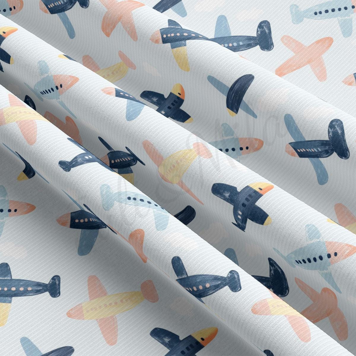 a pattern of airplanes on a white background