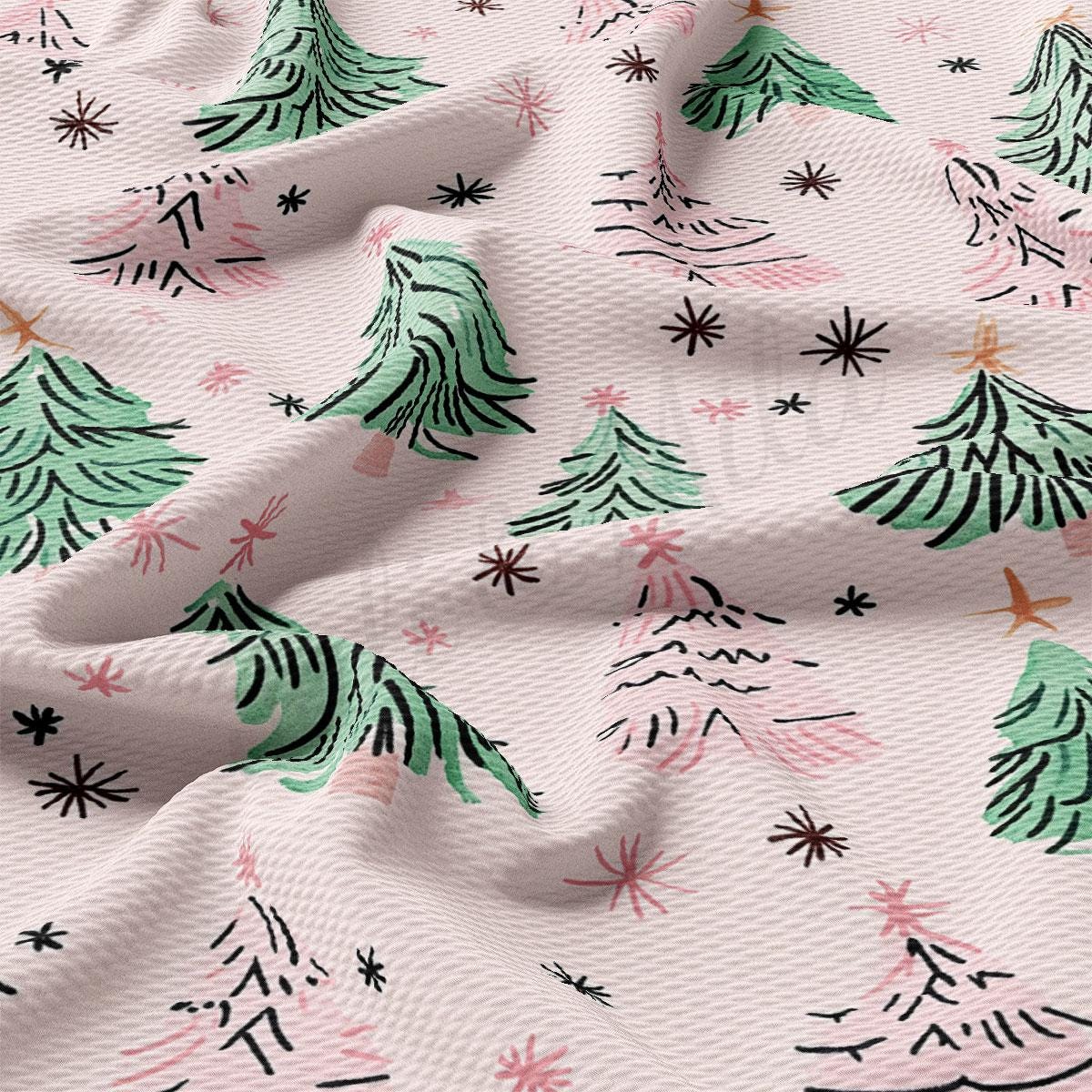 a close-up view of a fabric with a repeating pattern of green Christmas trees and small white stars.