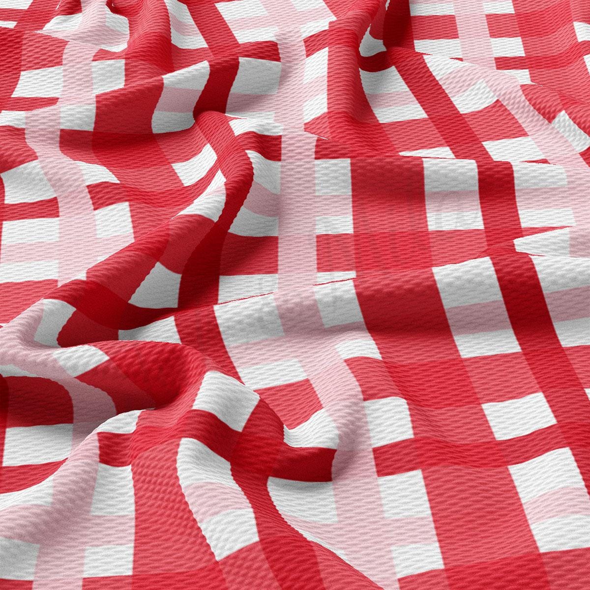 a red and white checkered fabric is shown