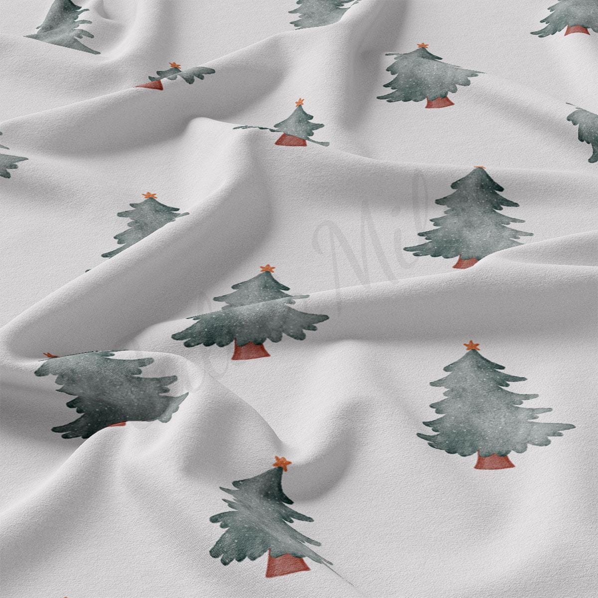 a close up of a white fabric with trees on it