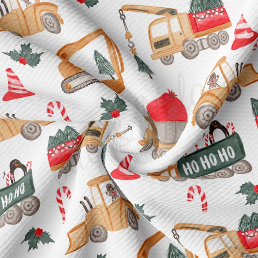 a white fabric with a christmas themed design on it