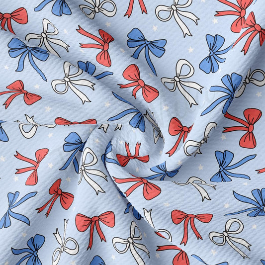 a blue background with red, white and blue bows