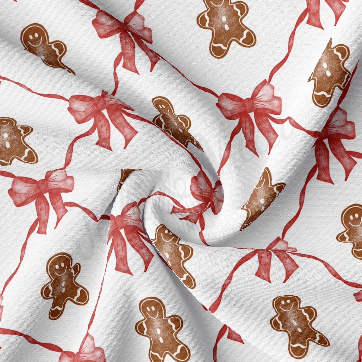 a close up of a red and white fabric with a pattern of gingerbreads