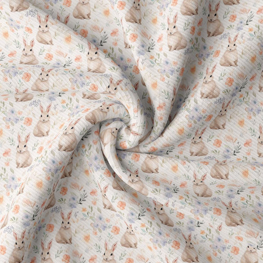 a close up of a white fabric with a cat pattern