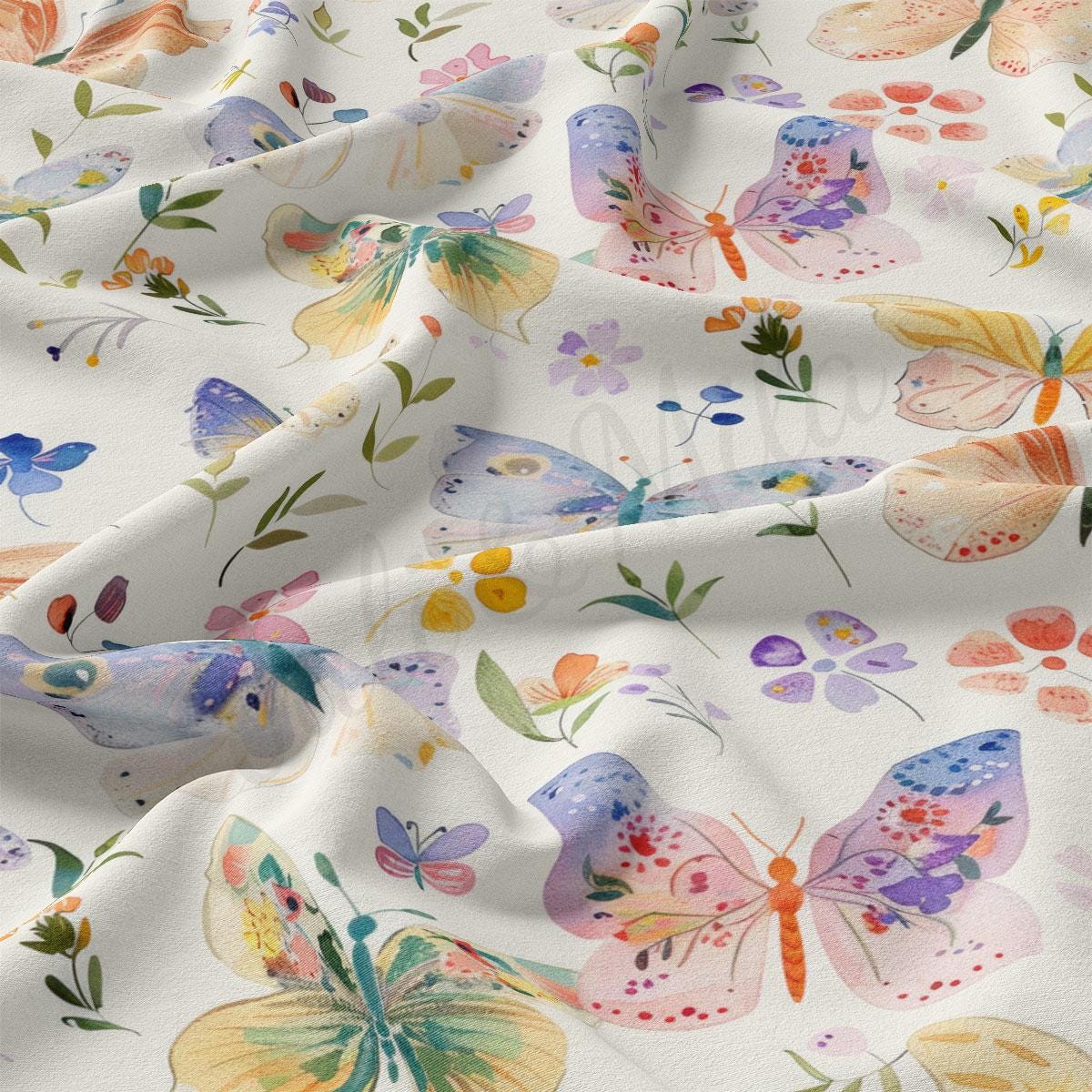 a white fabric with colorful butterflies on it