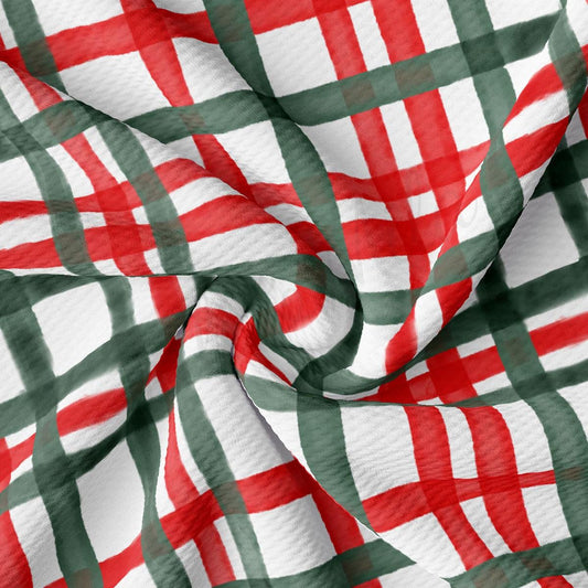 The image is a close-up of a fabric with a repeating pattern of red and green stripes, resembling a plaid or checkered design.