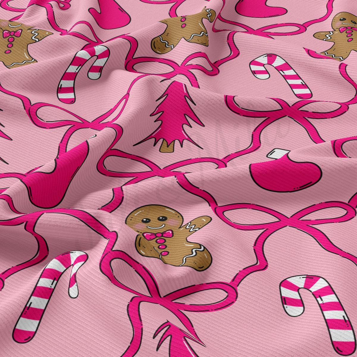 a pink fabric with a repeating pattern of Christmas-themed elements, including gingerbread men, candy canes, and a bow.