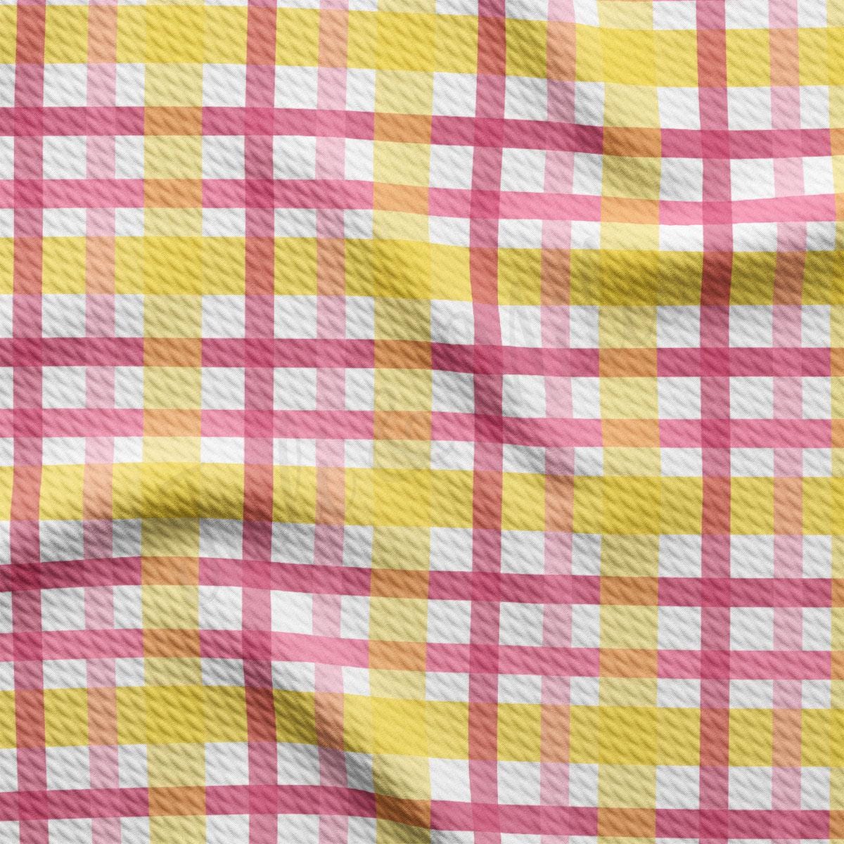 a yellow and pink checkered fabric is shown