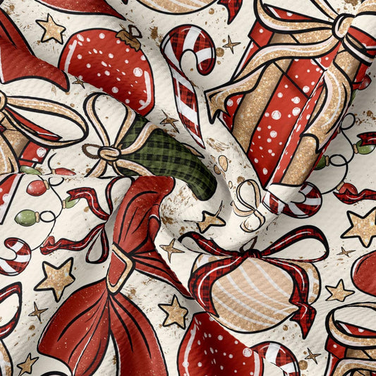 The image is a close-up of a fabric with a festive Christmas-themed pattern. It features various Christmas-related elements such as red and gold ornaments, candy canes, bows, and stars. The overall design is vibrant and colorful, creating a cheerful and holiday atmosphere.