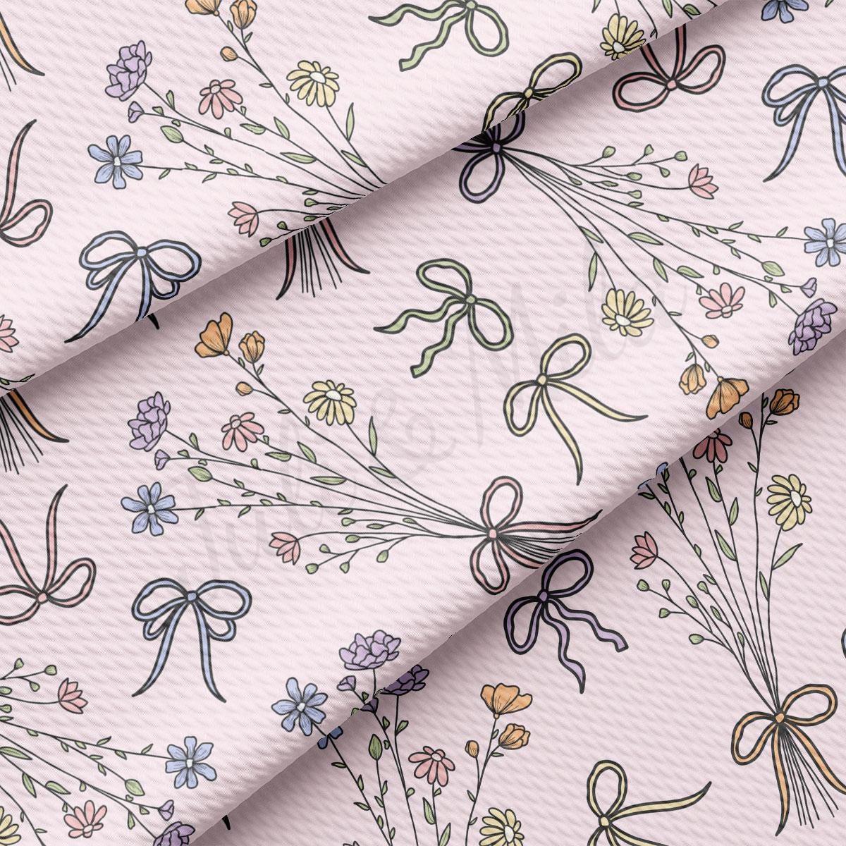 a white fabric with a bunch of flowers on it