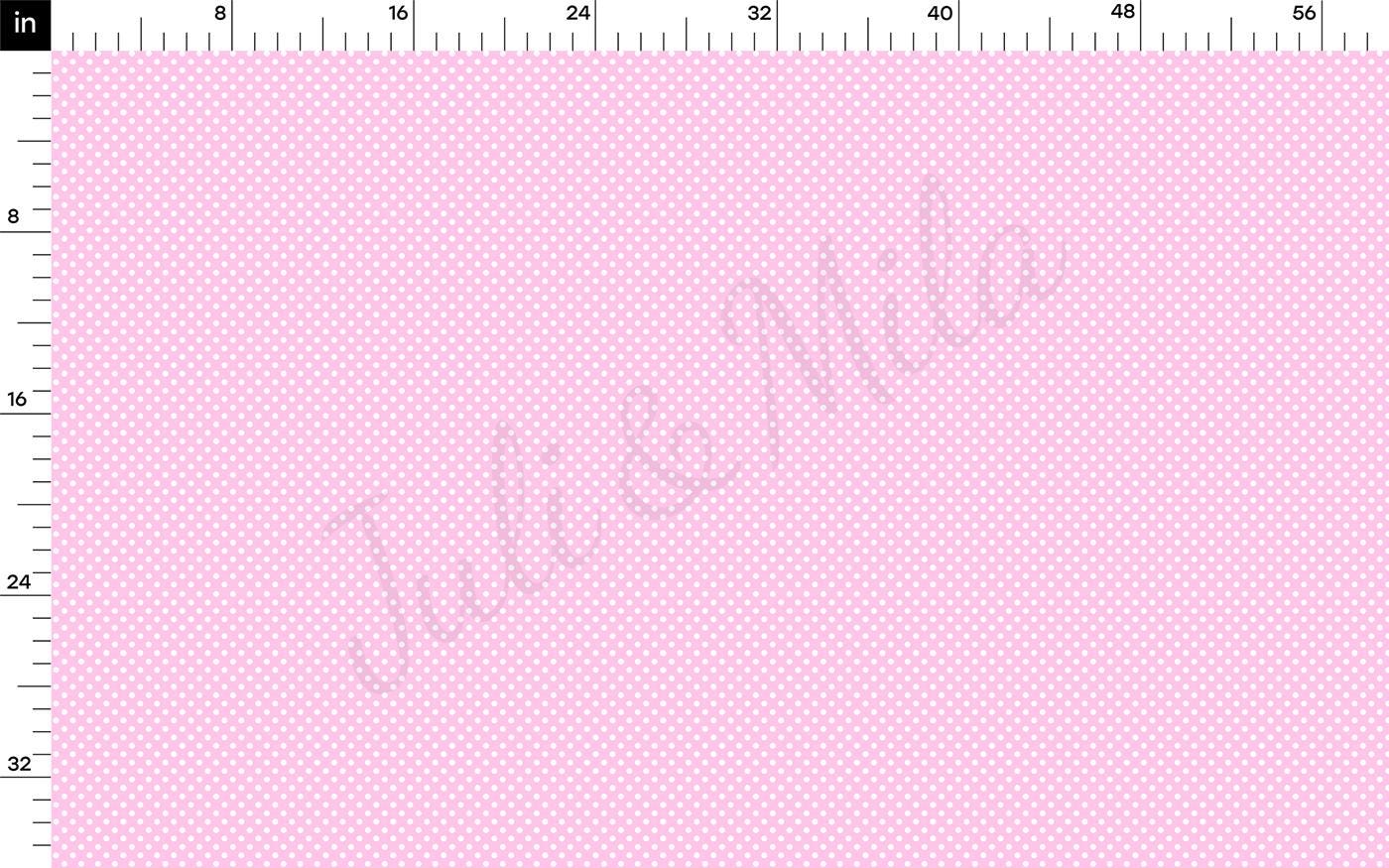 a pink dotted paper with a ruler on it