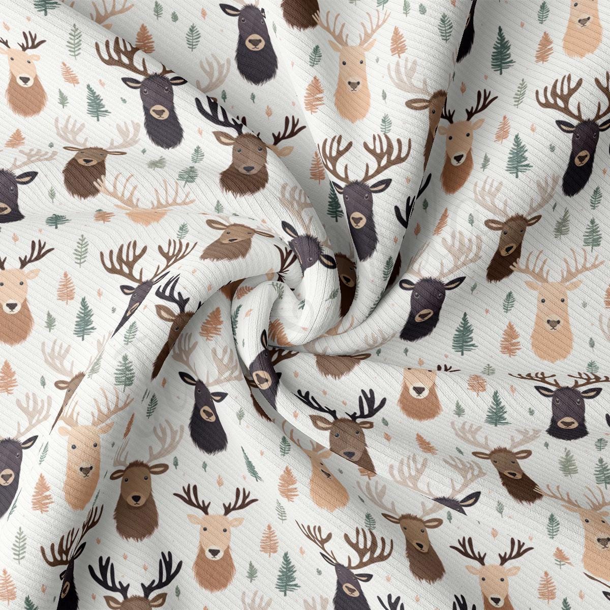 a close up of a white fabric with deer heads on it