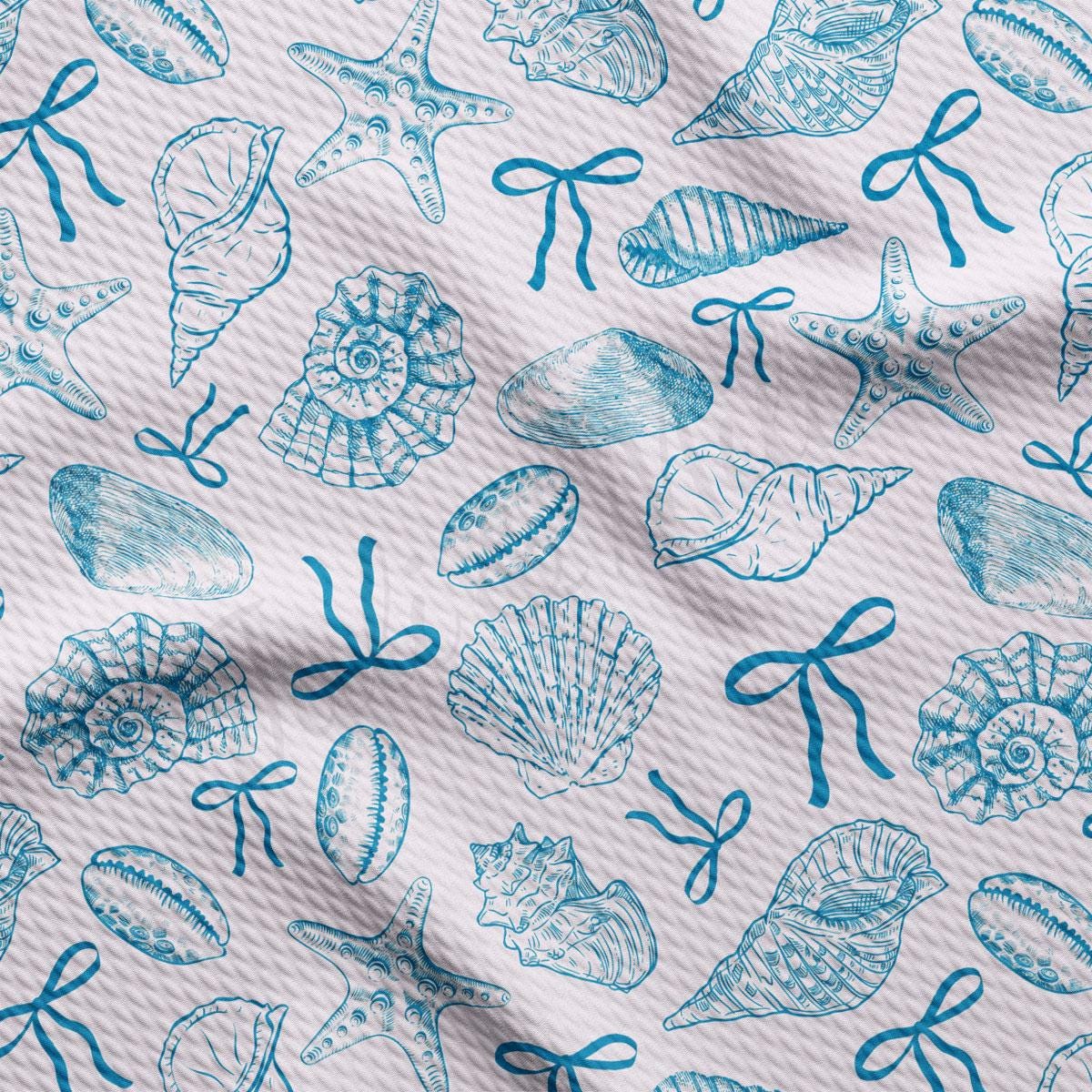 a blue and white pattern of seashells on a white background