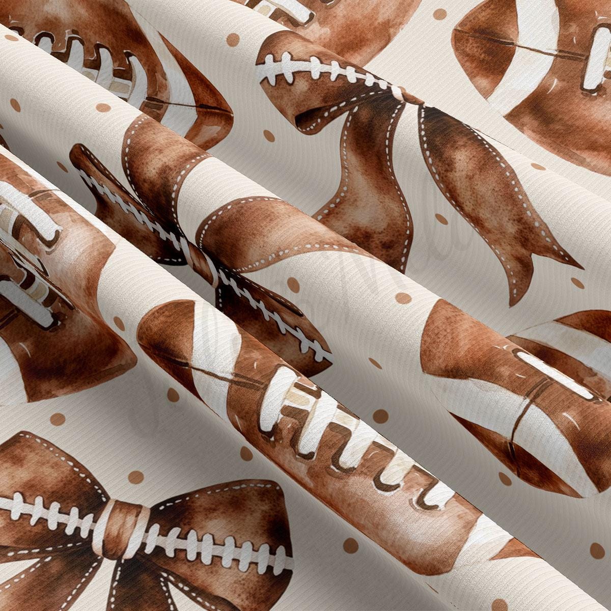 a close-up view of a fabric with a repeating pattern of brown and white footballs and a bowtie.