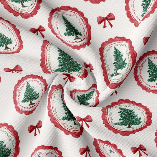 a close-up view of a fabric with a repeating pattern of Christmas trees and red bows.