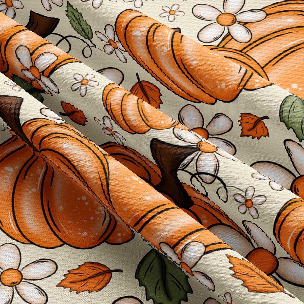 a close-up view of a fabric with a repeating pattern of orange pumpkins and white flowers. The pumpkins are depicted in various sizes and orientations, creating a dynamic and visually interesting design. The flowers are scattered throughout the fabric, adding a touch of nature and color to the overall composition. The fabric appears to be made of a soft, textured material, which would make it suitable for clothing or home decor items.