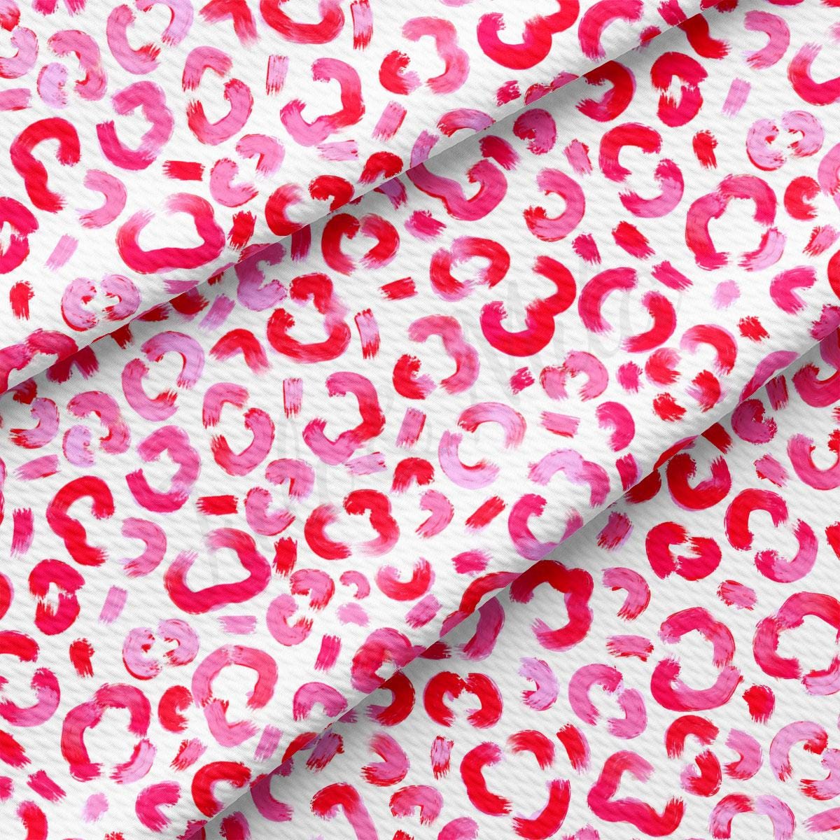 a pink and red animal print fabric