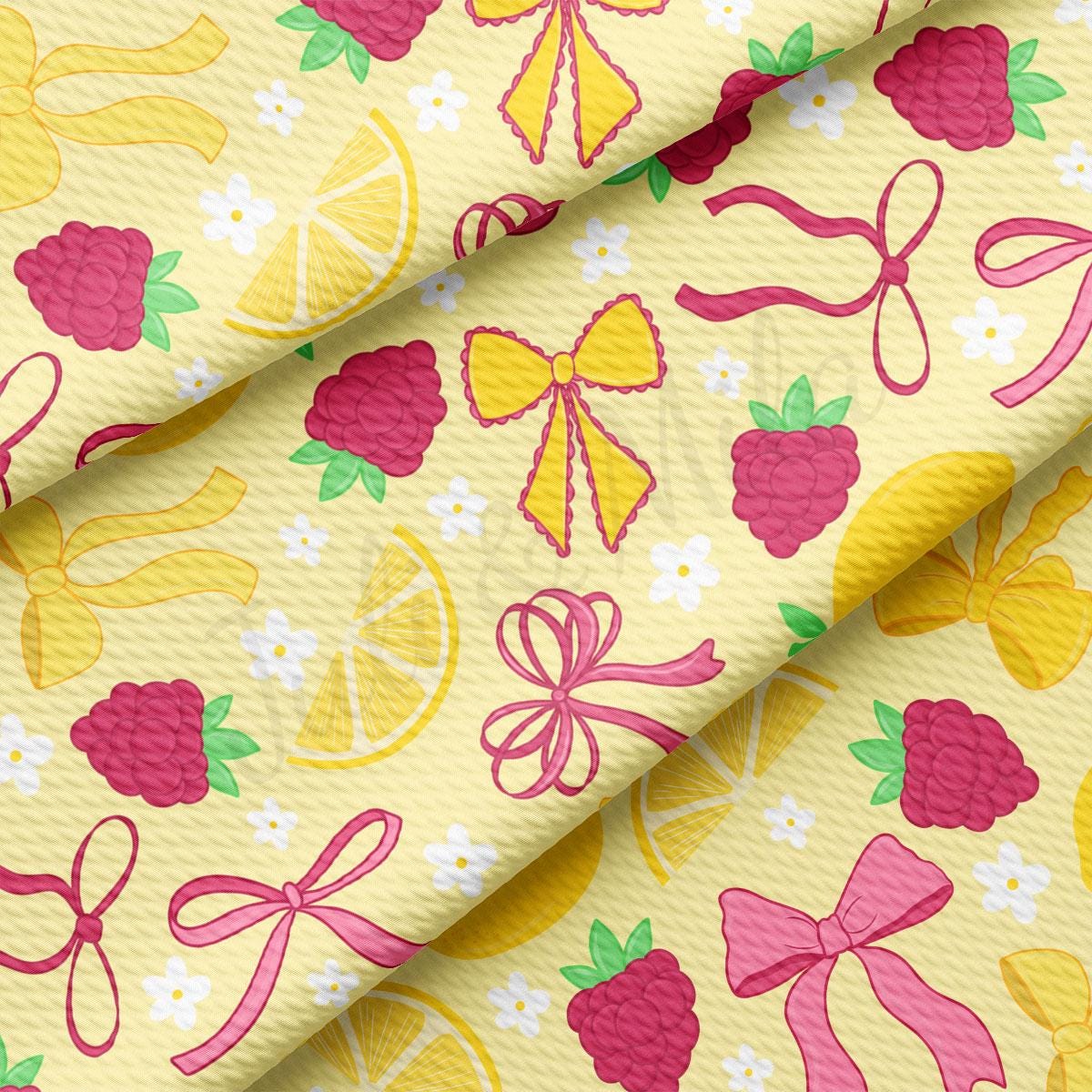 a yellow background with pink and yellow bows and lemons