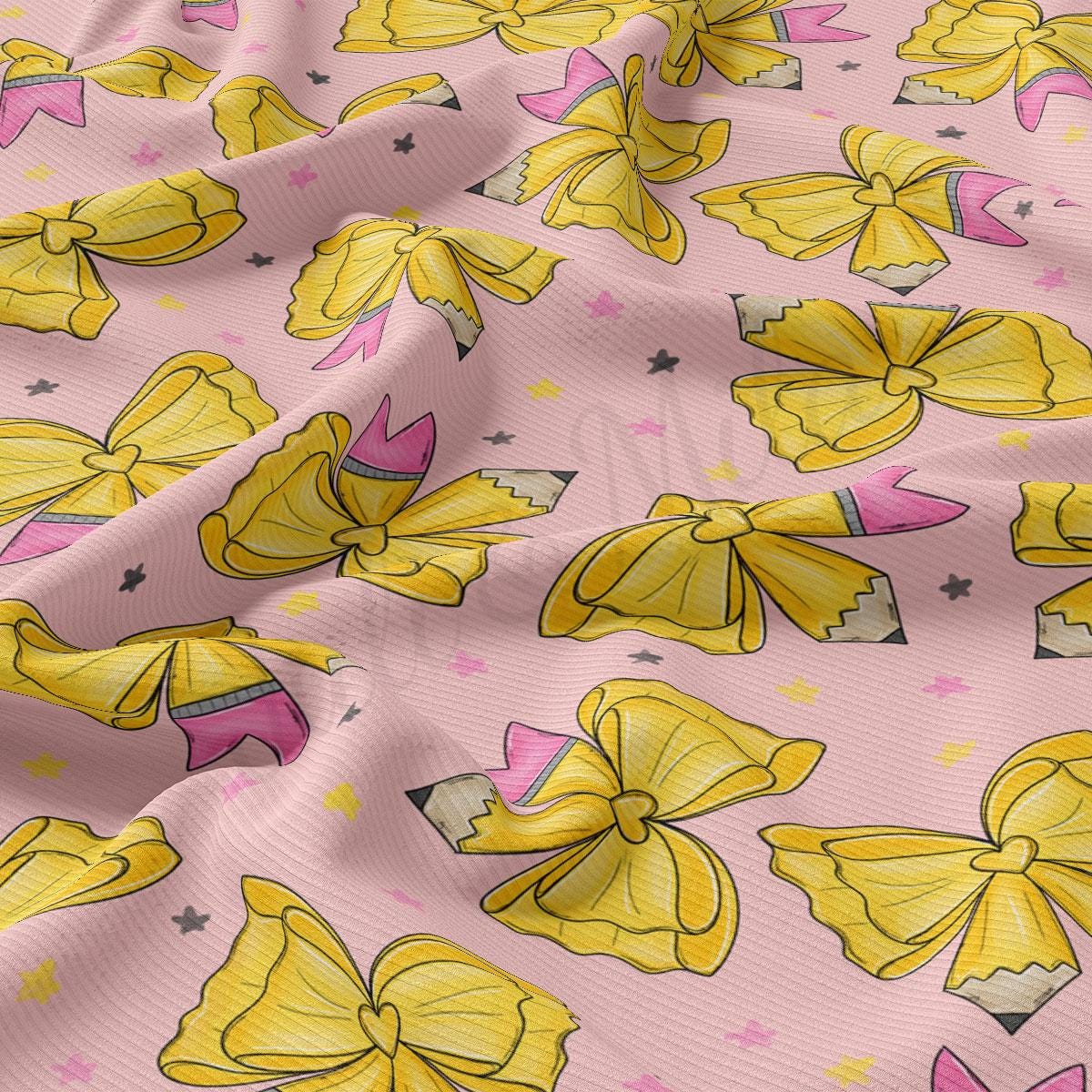 a repeating pattern of yellow and pink bows on a pink background, with small black stars scattered throughout.