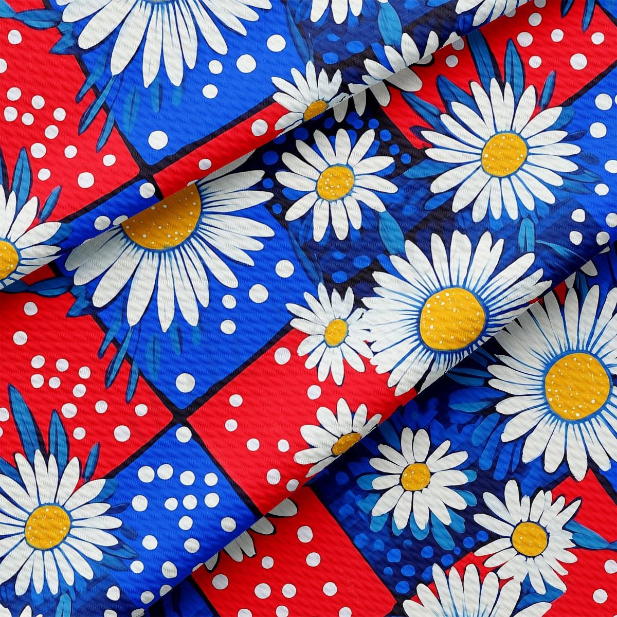 a red, white, and blue tie with daisies on it