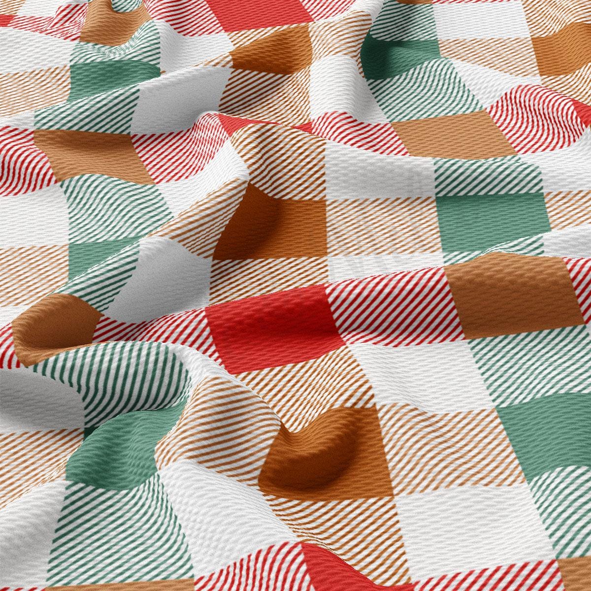a close-up view of a fabric with a vibrant, multicolored plaid pattern. The fabric has a mix of red, green, white, and brown colors, creating a visually striking and textured appearance.