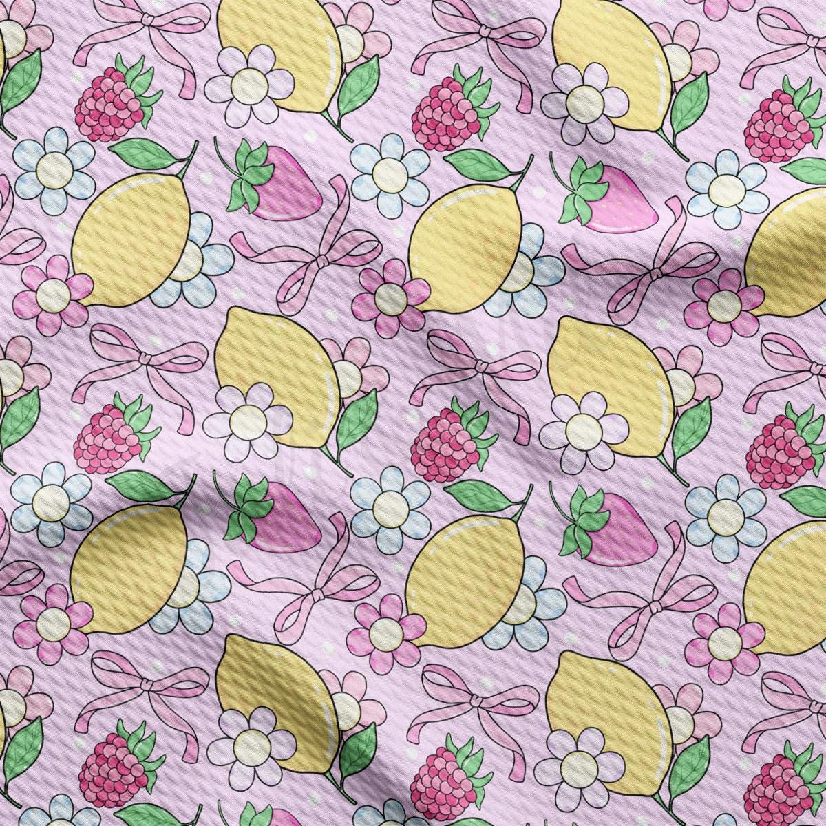 a pattern of lemons and berries on a pink background