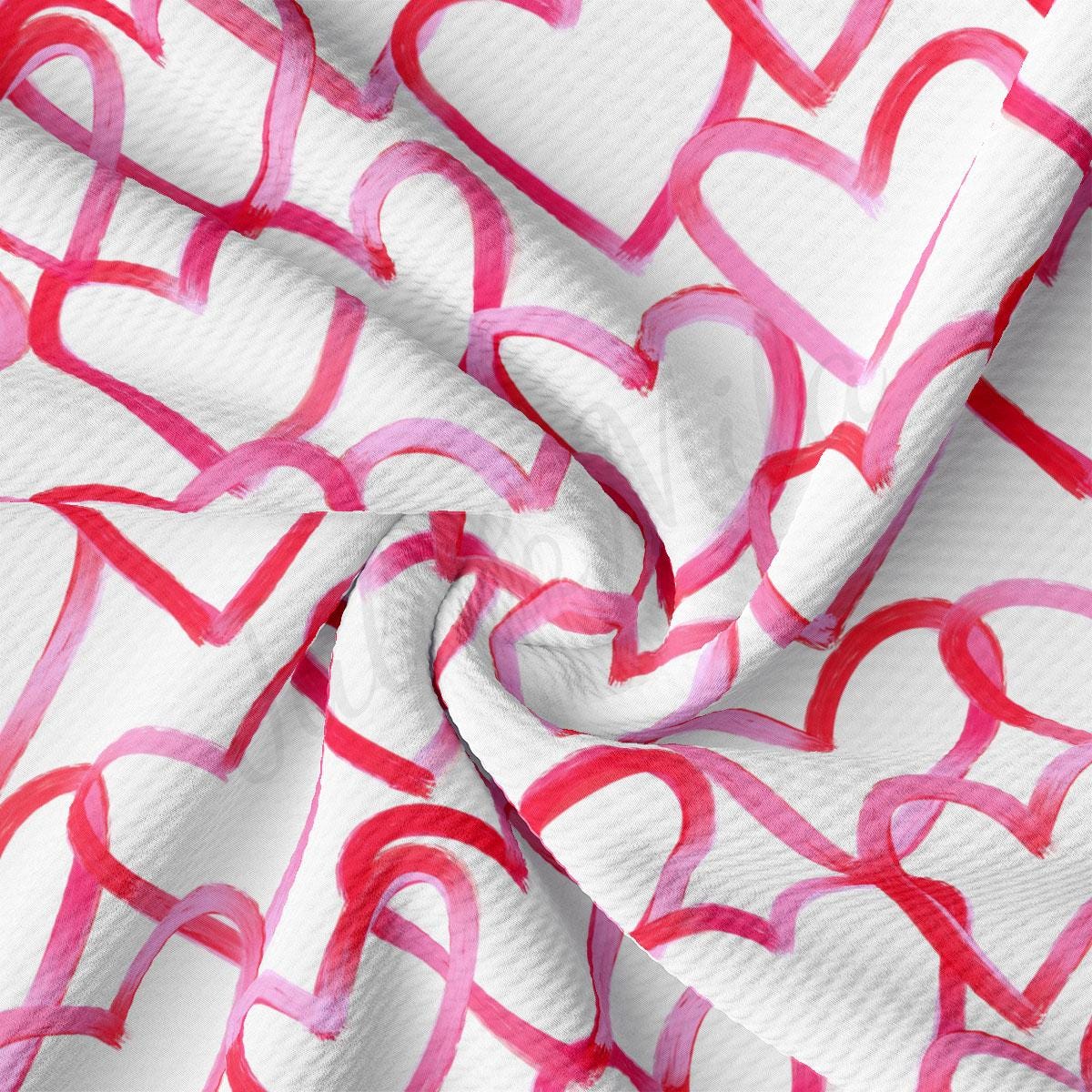 a close up of a white and pink fabric with hearts on it