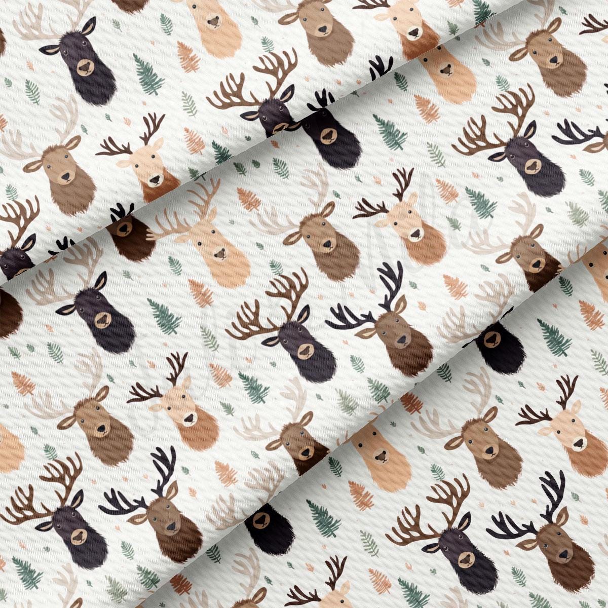 a pattern of deer heads on a white background