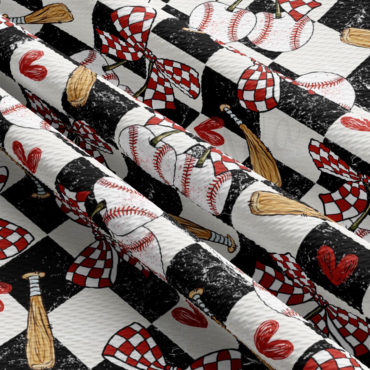 a close-up view of a fabric with a repeating pattern of baseballs, bats, and hearts in red and white colors.