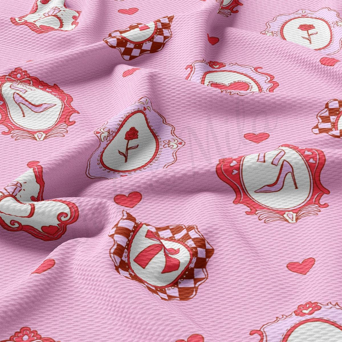 a pink fabric with red hearts and hearts on it