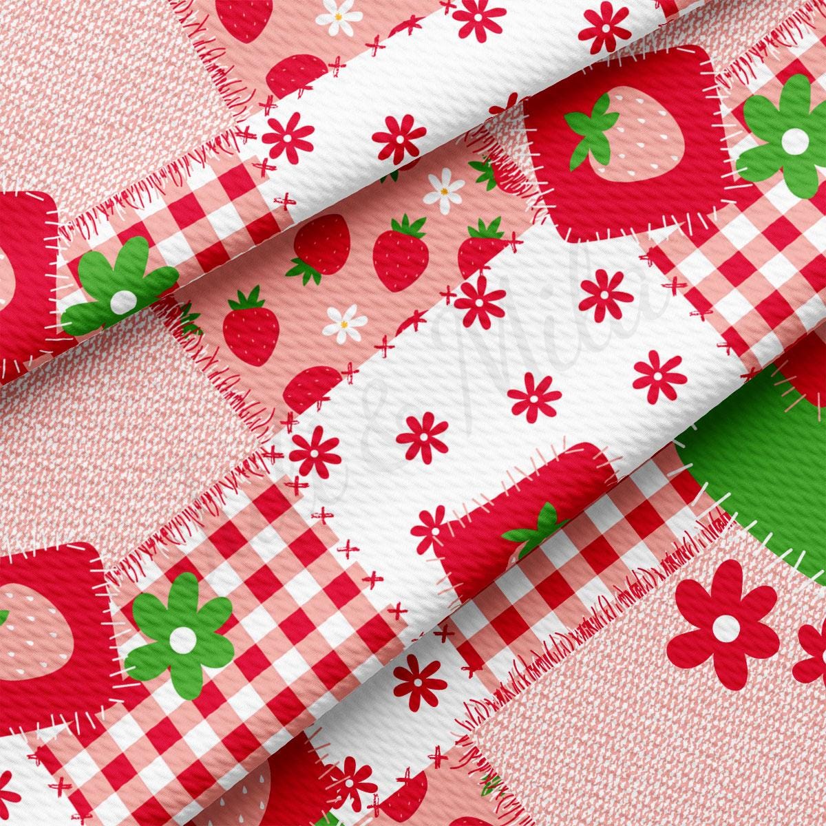 a red and white checkered fabric with strawberrys on it