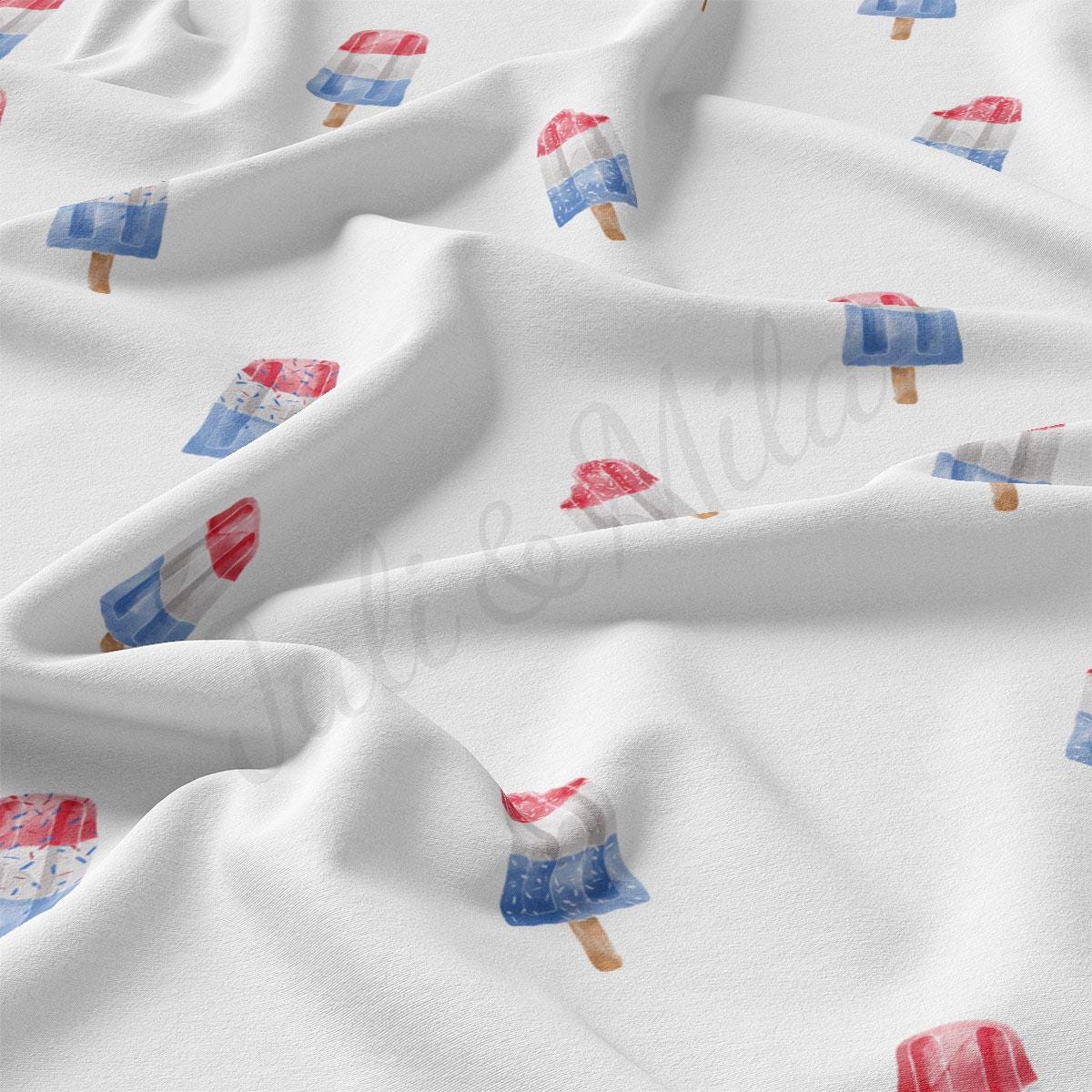 a close up of a white fabric with red, white, and blue ice cream