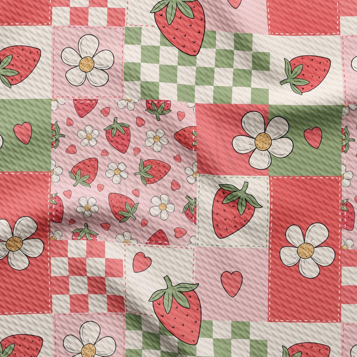 a pink and green checkered fabric with strawberries and flowers