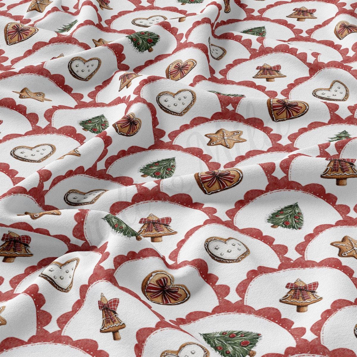 a close-up view of a fabric with a repeating pattern of Christmas-themed cookies and decorations, including gingerbread cookies, stars, and pine trees.