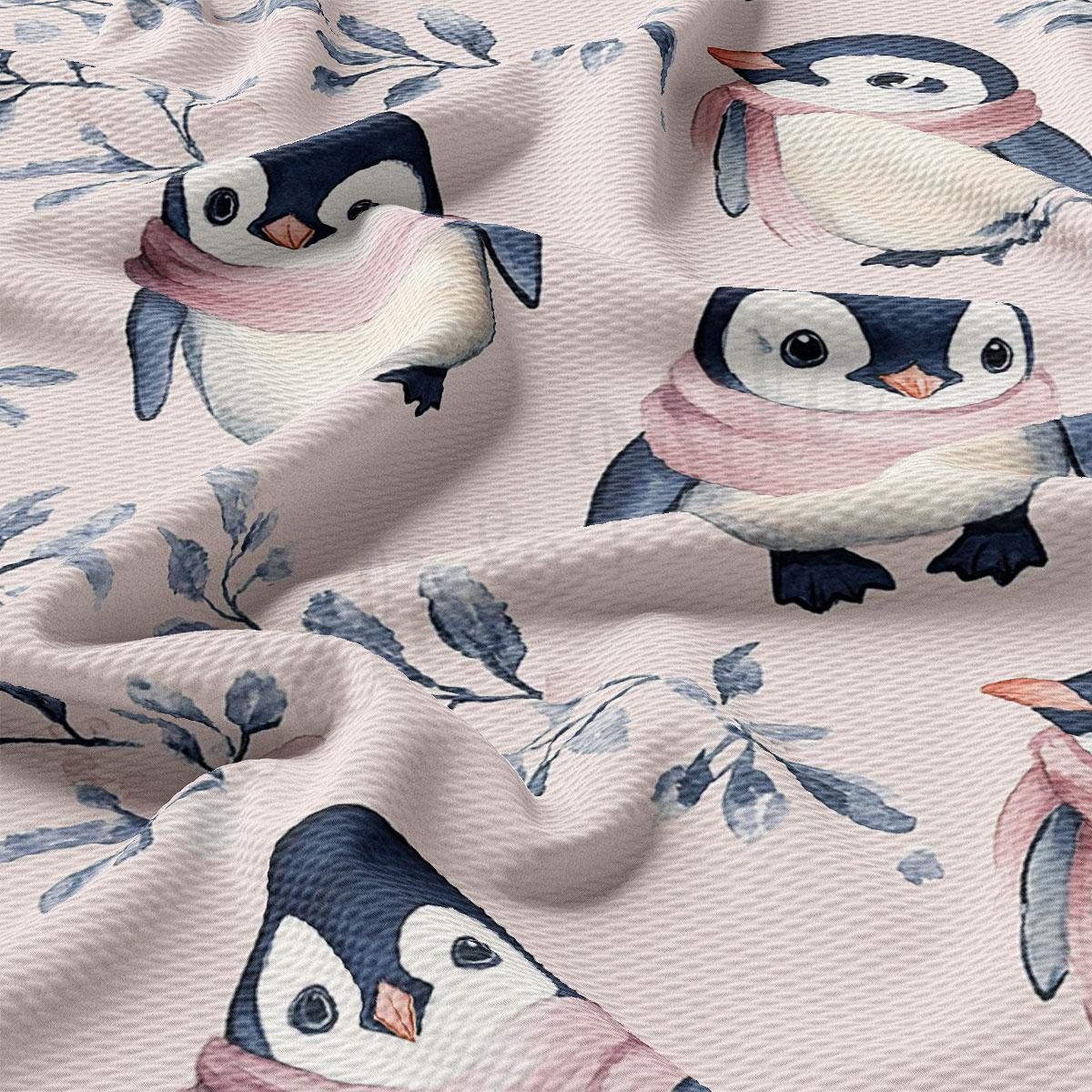 a close-up view of a fabric with a repeating pattern of penguins wearing pink scarves.