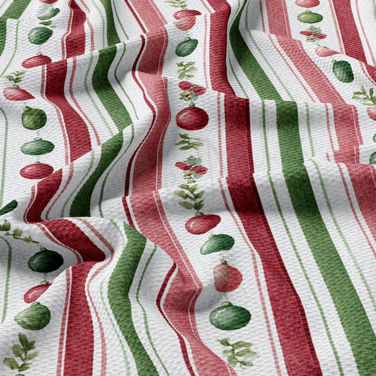 The image is a close-up view of a fabric with a repeating pattern of red, green, and white stripes. The pattern features various objects such as apples, oranges, and leaves, creating a festive and colorful design.