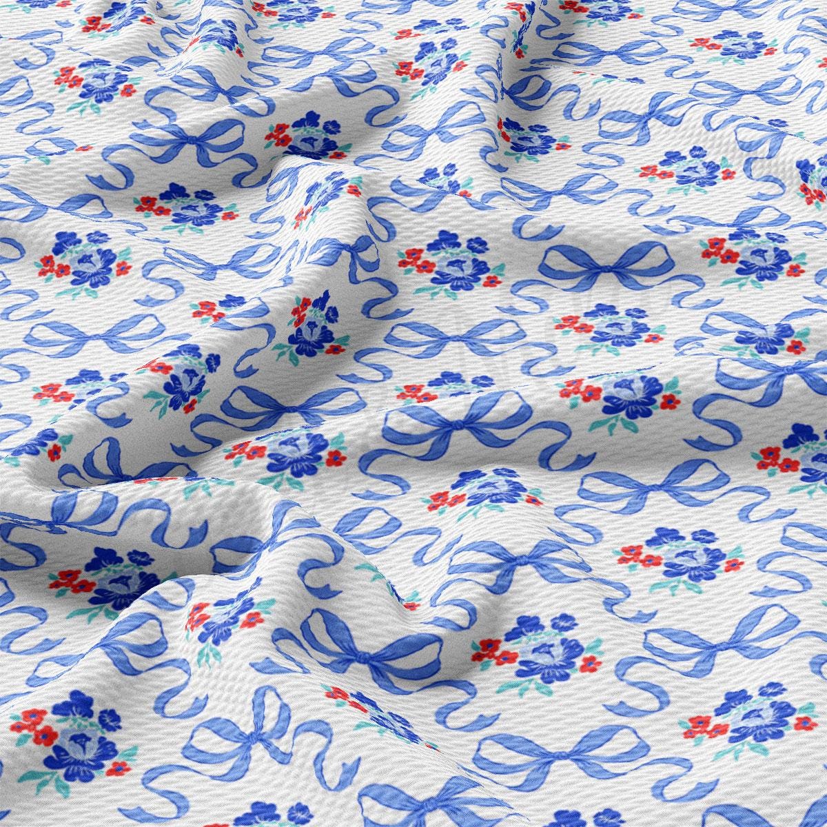 a blue and red floral print on a white background