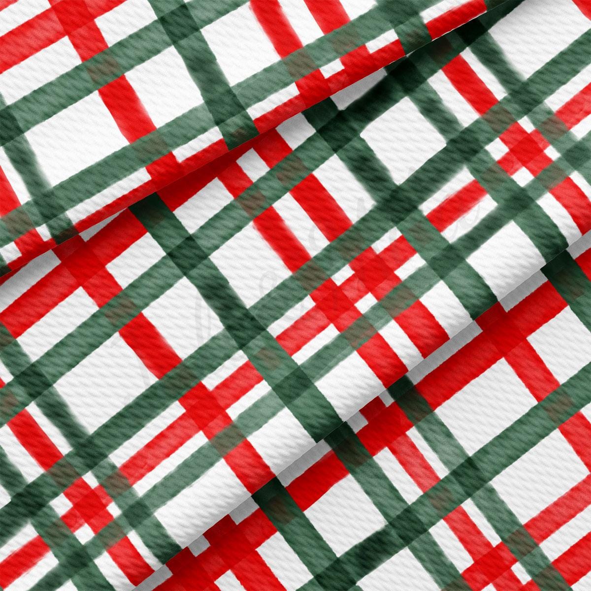 a close-up view of a fabric with a repeating pattern of red and green stripes. The pattern is diagonal, creating a sense of movement and dynamism. The fabric appears to be made of a soft, textured material, which adds to its visual appeal. The image does not contain any discernible text or countable objects, and the focus is solely on the fabric and its pattern.