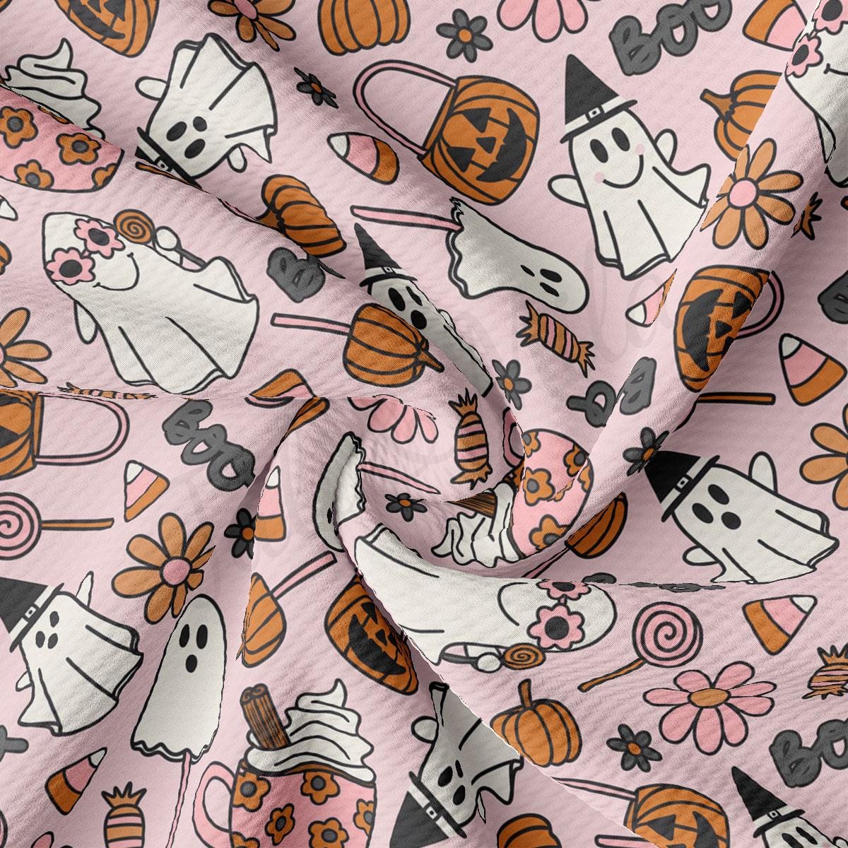 a pink background with a lot of halloween items on it