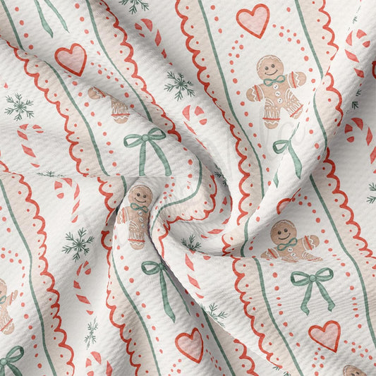 The image is a close-up of a fabric with a repeating pattern of gingerbread men, snowflakes, and green bows.