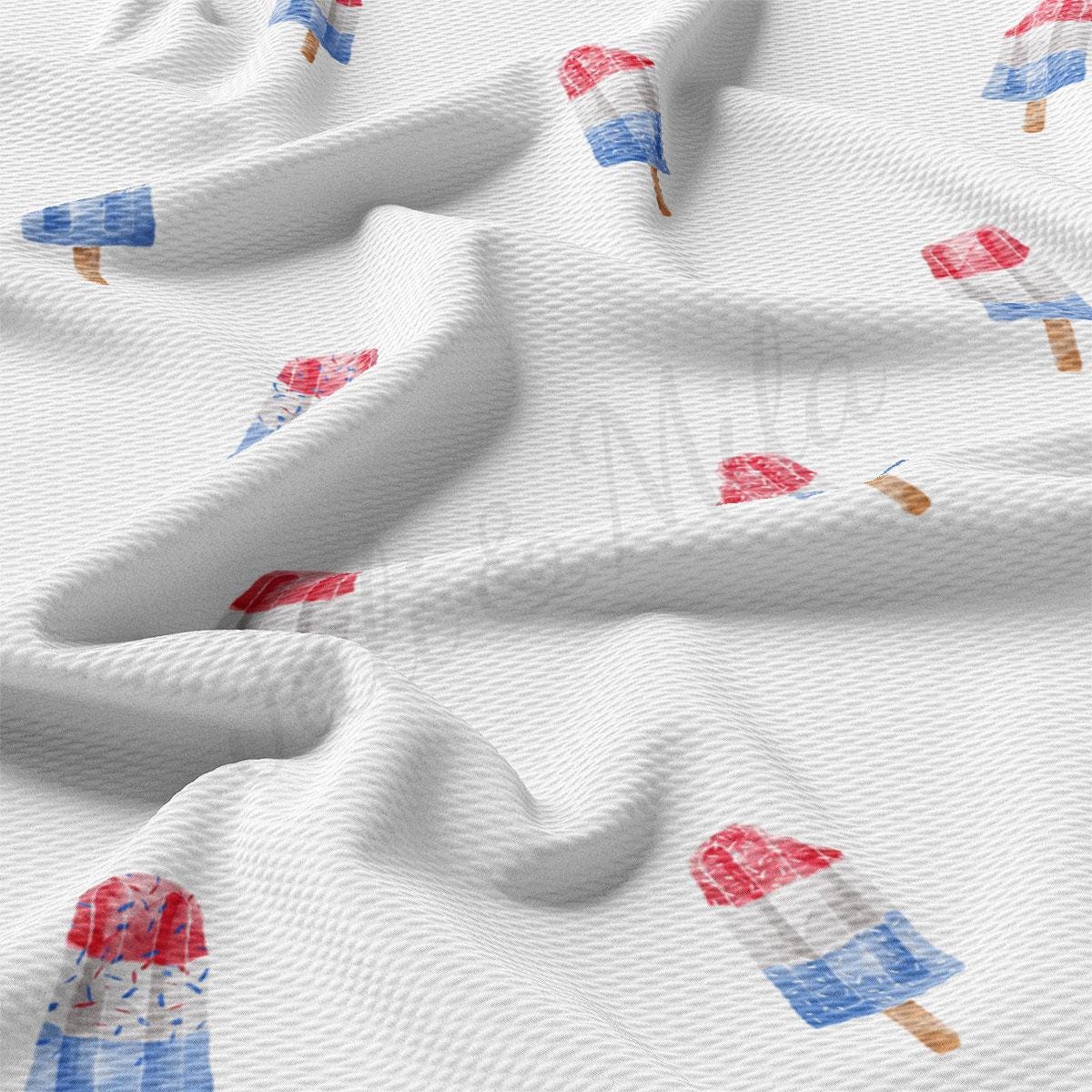 a close up of a white fabric with red, white, and blue ice cream