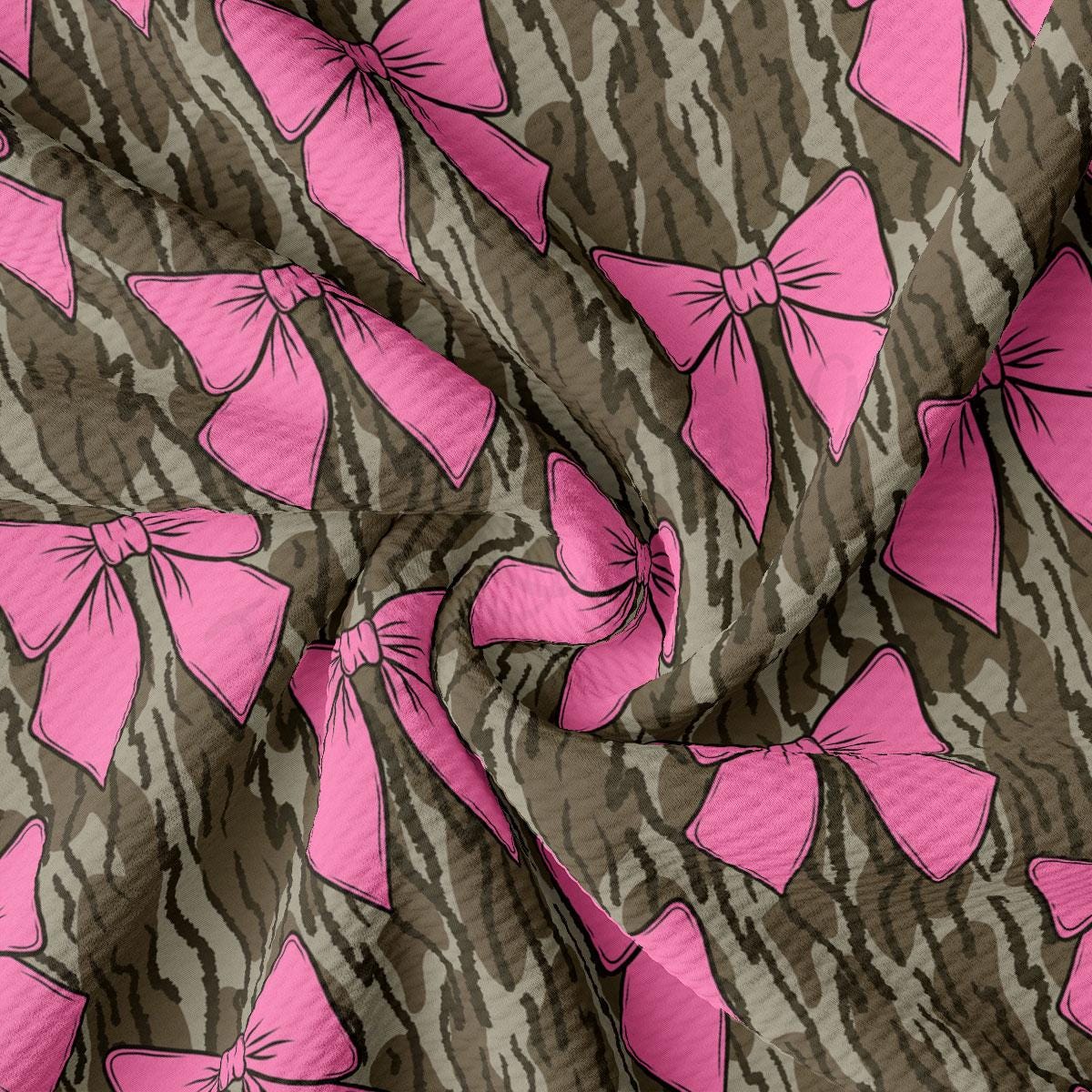 a pink and brown pattern with bows on it