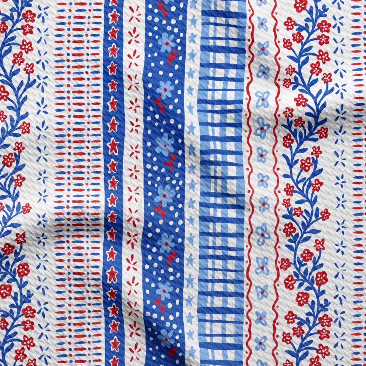 a blue and white striped fabric with red and white flowers