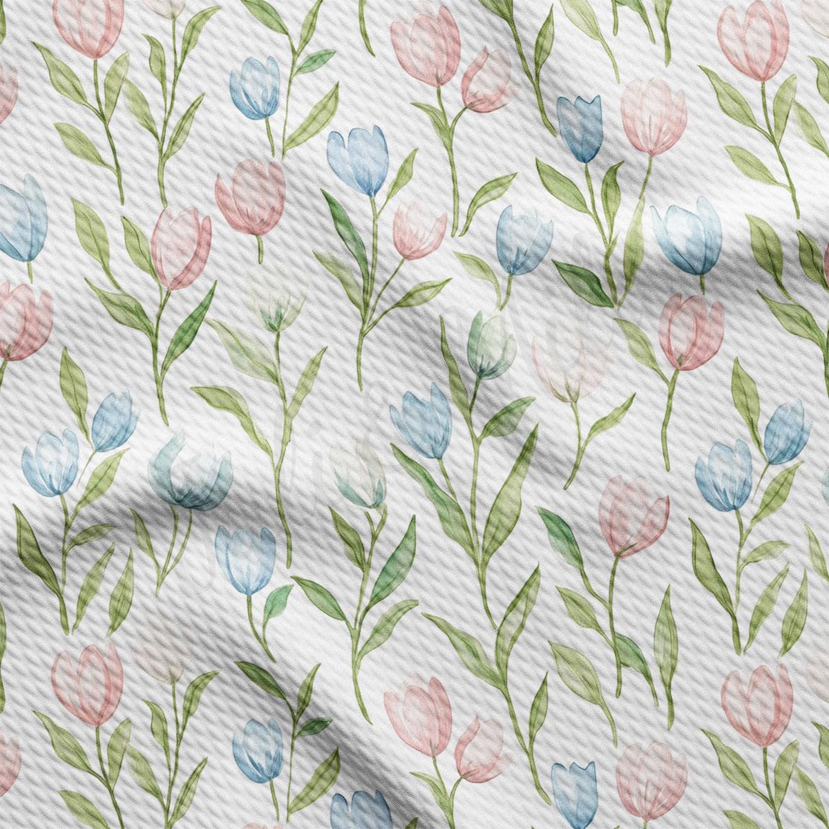 a repeating pattern of pink, blue, and green flowers with green leaves on a white background.