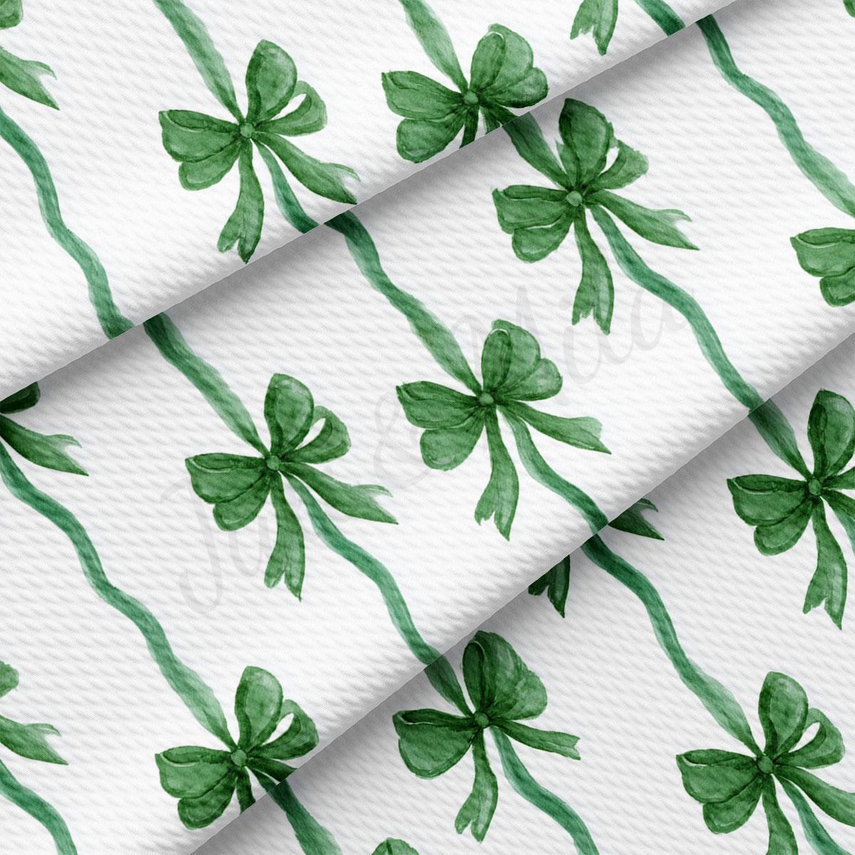 a repeating pattern of green bows on a white background.