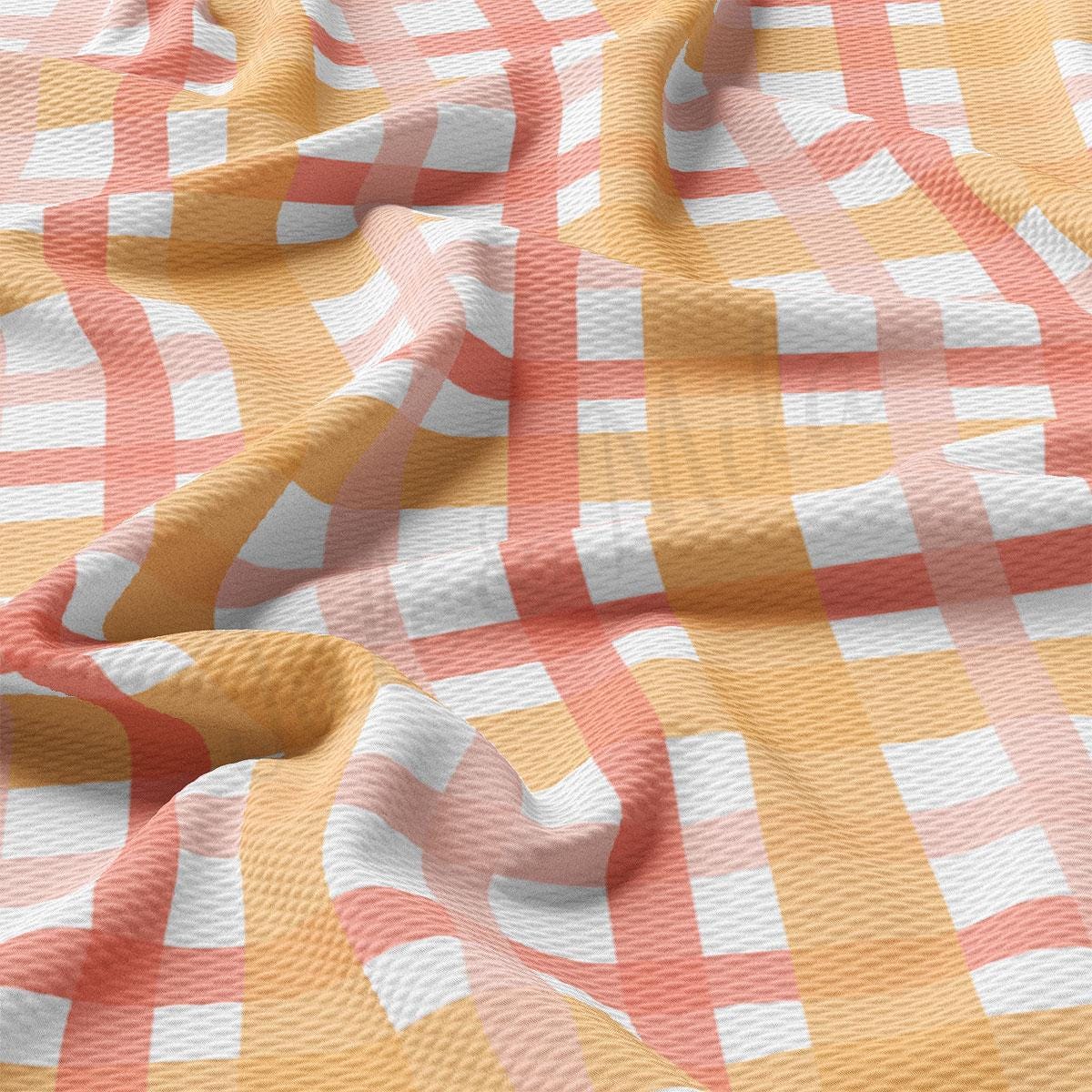 an orange and white checkered fabric with a pattern