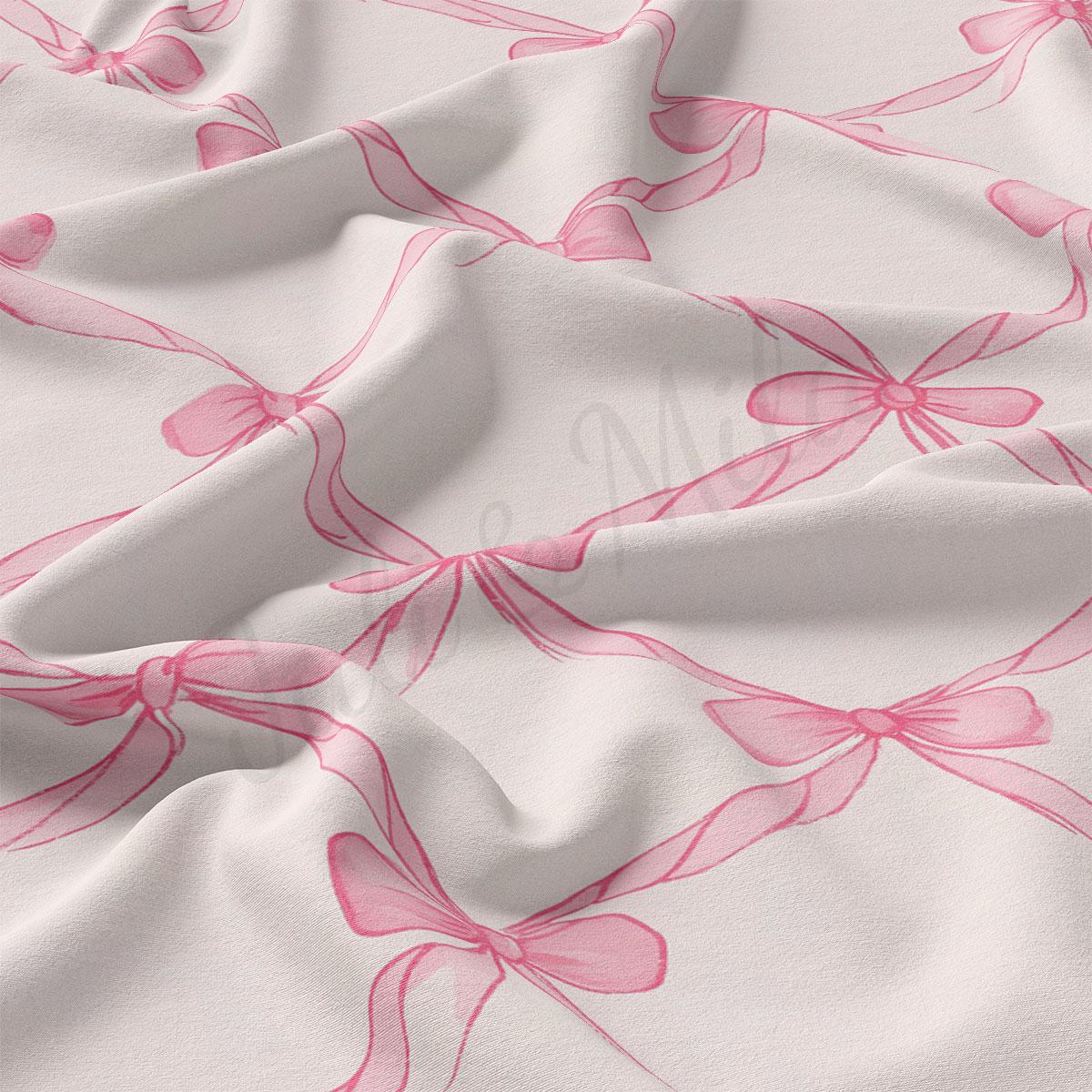 a close-up view of a fabric with a repeating pattern of pink bows on a white background.