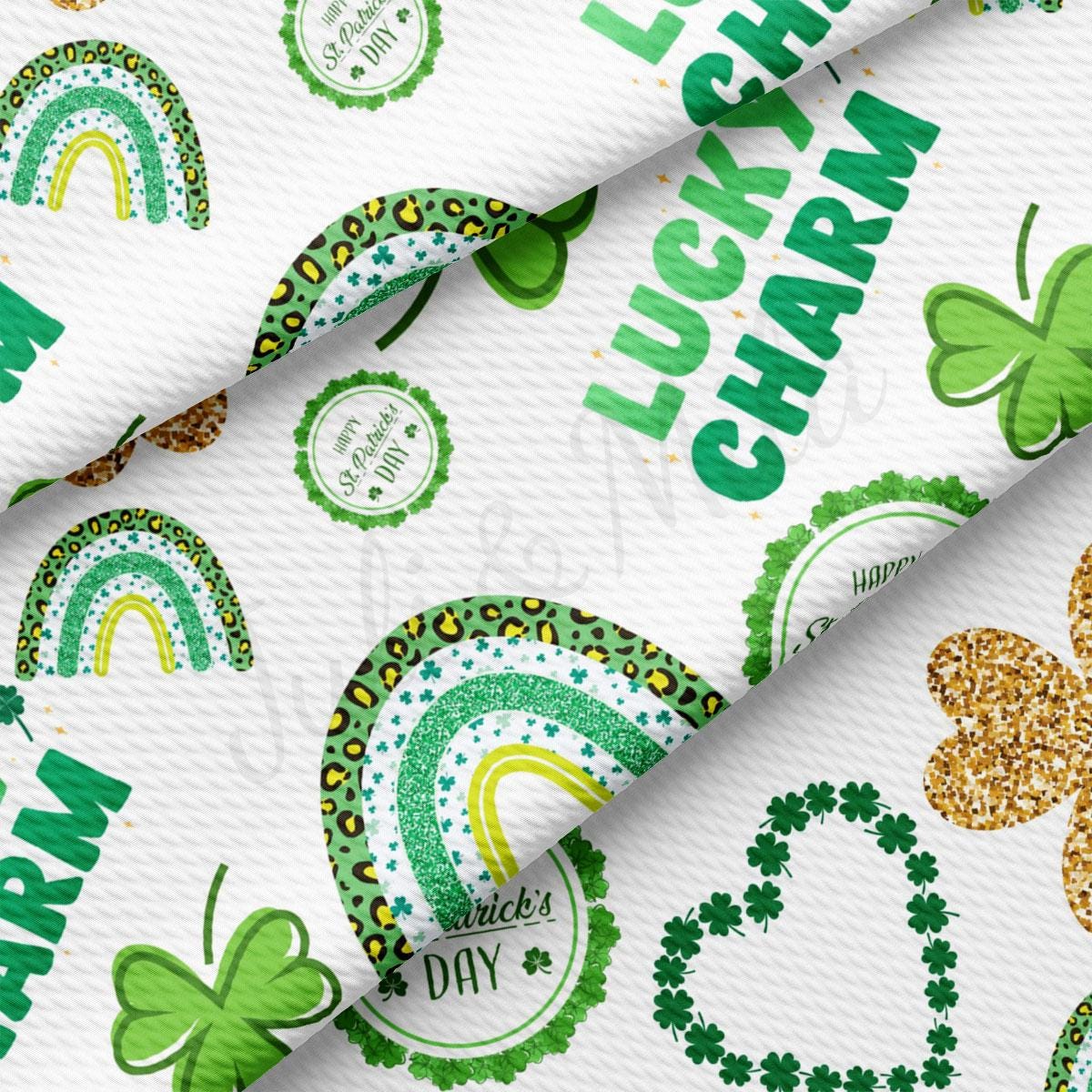 a white background with green shamrocks and a rainbow